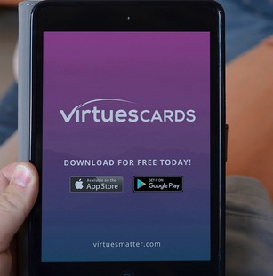 A smartphone showing Virtues Cards application on the screen.